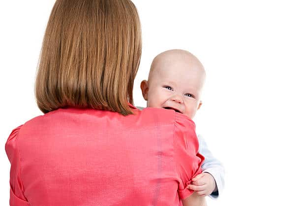 Baby Aggressively Rubbing Face into Shoulder