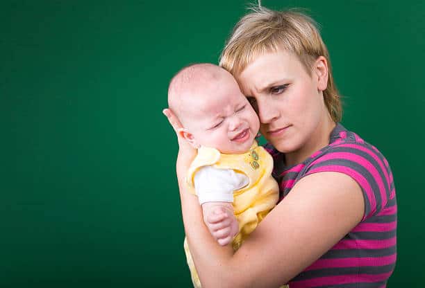 Baby Aggressively Rubbing Face into Shoulder