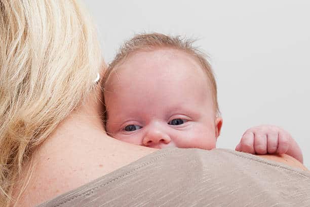 Baby Aggressively Rubbing Face into Shoulder