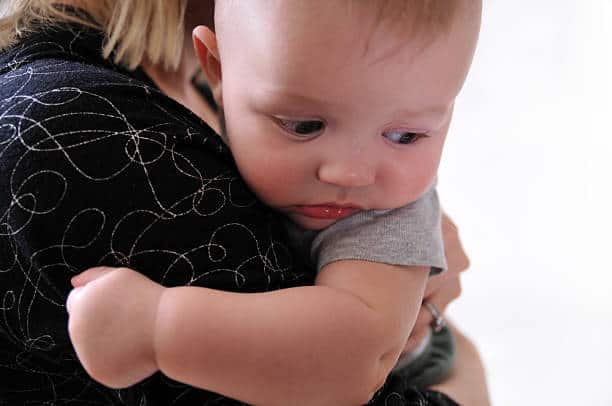 Baby Aggressively Rubbing Face into Shoulder